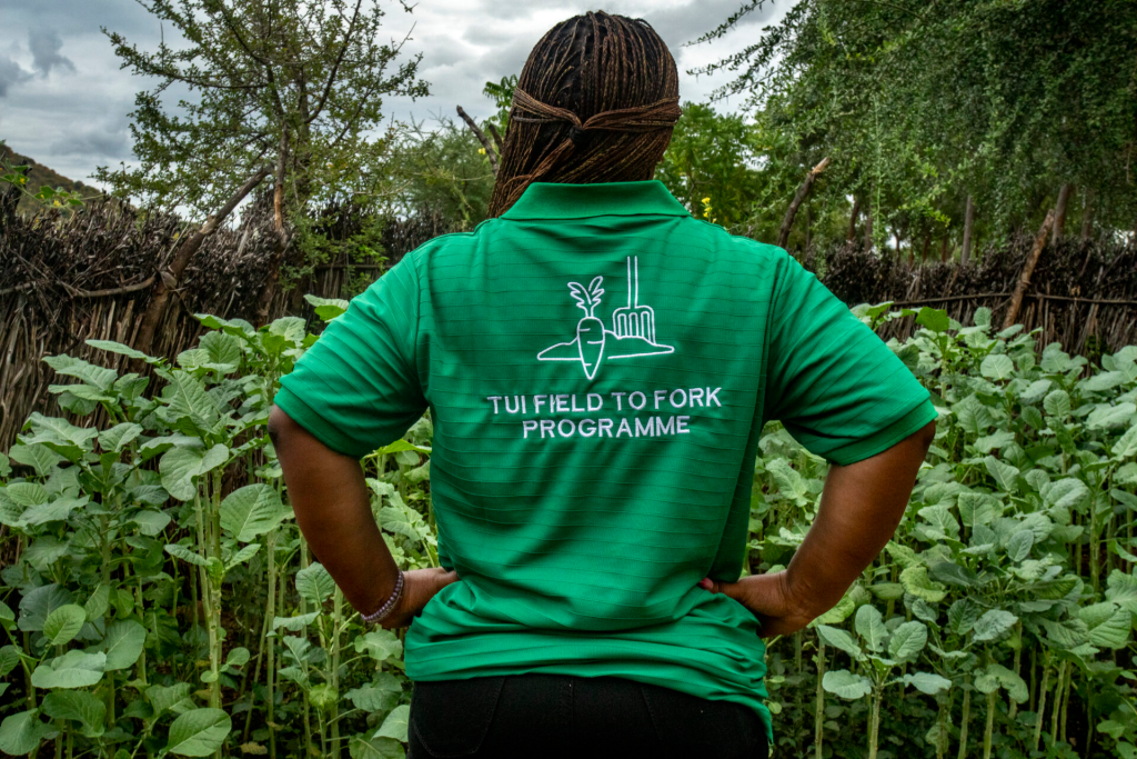 A women wearing a green branded TUI Field to Fork t-shirt